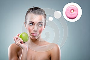 Â The Diet! Woman eating an apple , but he thinks a donut